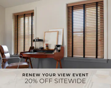 2 Inch Oak Wood Blinds hang in an office with a wood desk & leather chair with overlaid sales messaging for 20% off sitewide