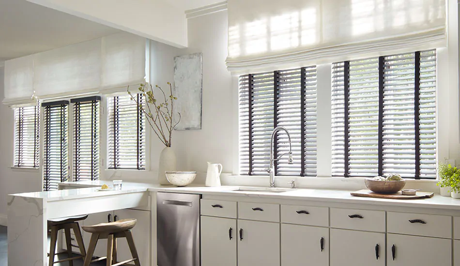 Layered window treatments include Flat Roman Shades in Tangier Weave, Blanco and Wood Blinds, Painted Bamboo in Coal