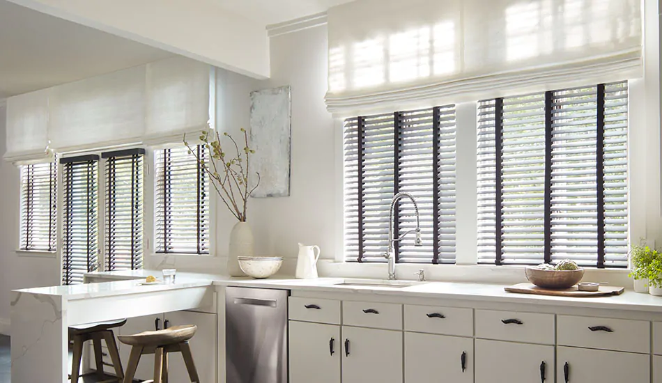 A window treatment buying guide outlines Blinds options, like Wood Blinds in Painted Bamboo, Coal, in a bright kitchen
