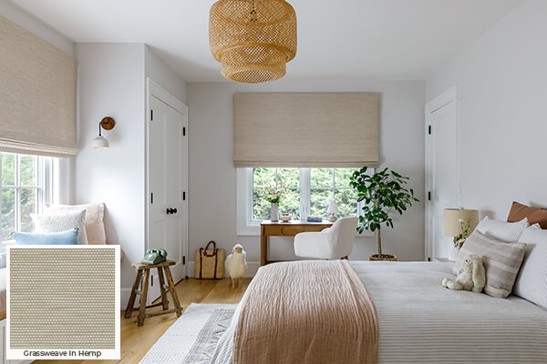 Soft weaves found in these Waterfall Woven Shades in a boho-inspired bedroom are one of the window treatment trends 2024