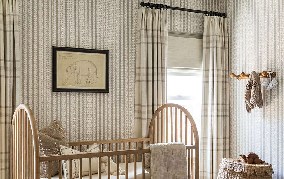 Nursery curtains made of Aberdeen in Bisque complement other textures in the room like wallpaper and woven textiles