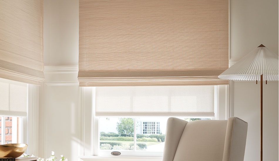 A playroom features Woven Wood Shades made of Somerset in Cloud layered with a Solar Shade of 1% Solistico in Oatmeal